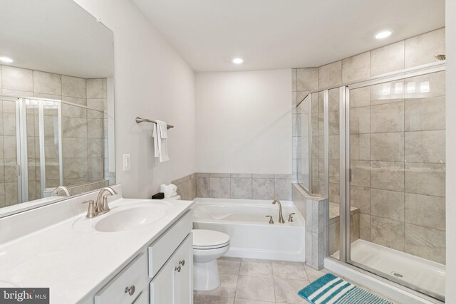 5504 Lanteen St, Lanham, MD 20706 - full bathroom with vanity, toilet, a bath, tile patterned floors, and a stall shower