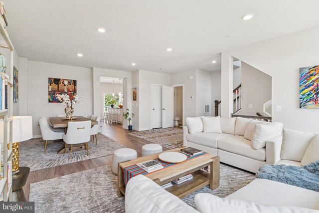 5504 Lanteen St, Lanham, MD 20706 - living area with wood finished floors, stairs, recessed lighting, and baseboards