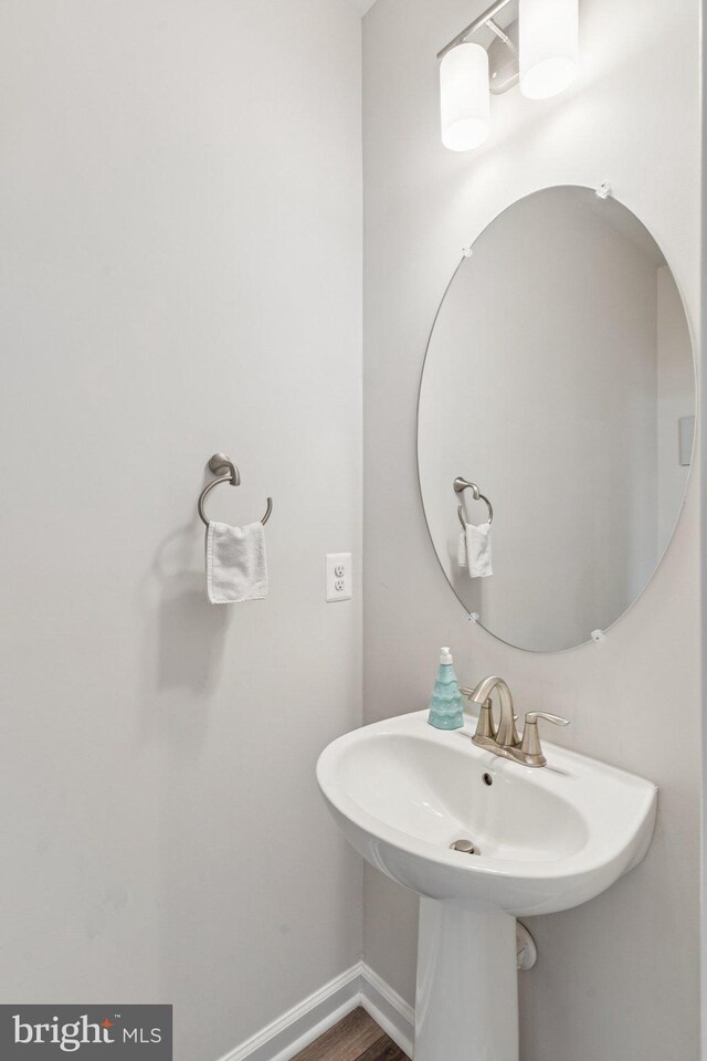 5504 Lanteen St, Lanham, MD 20706 - bathroom featuring a sink and baseboards