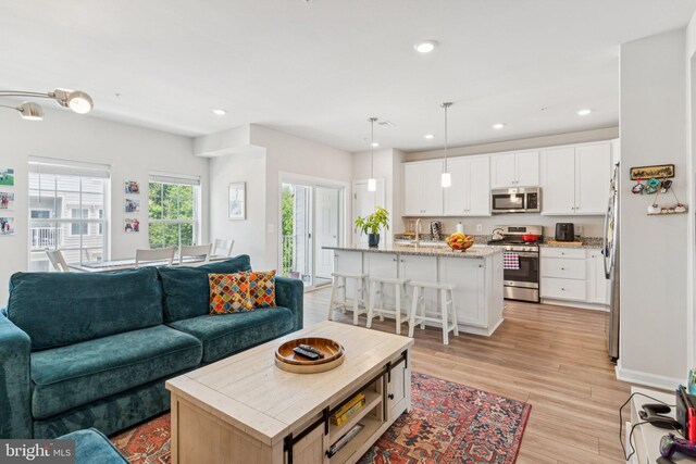 5504 Lanteen St, Lanham, MD 20706 - living area featuring light wood-style flooring and recessed lighting