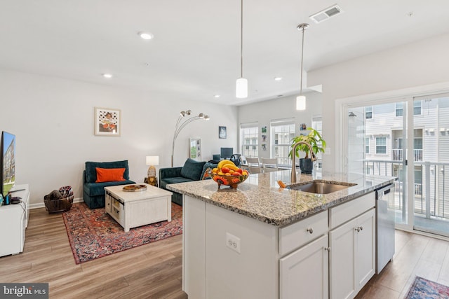5504 Lanteen St, Lanham, MD 20706 - kitchen featuring dishwasher, open floor plan, a sink, light wood finished floors, and recessed lighting