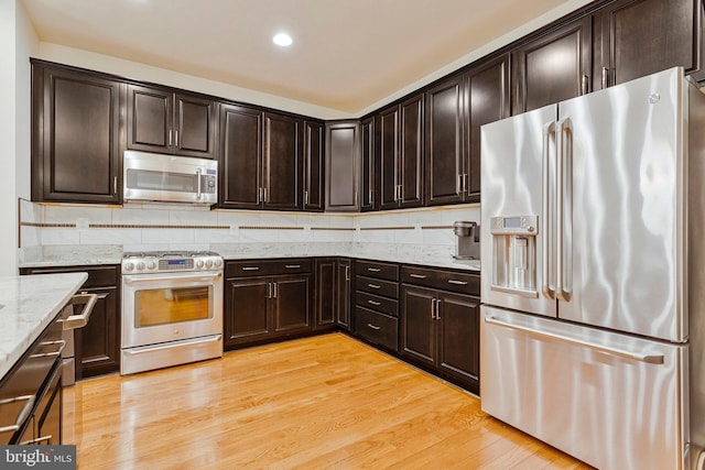 9726 Knowledge Dr, Laurel, MD 20723 - kitchen featuring stainless steel appliances, light stone countertops, light wood-style flooring, recessed lighting, and dark brown cabinets