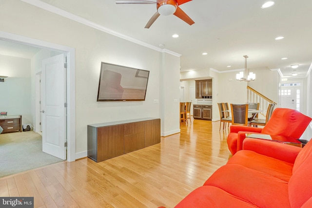 9726 Knowledge Dr, Laurel, MD 20723 - living area with a ceiling fan, ornamental molding, a chandelier, light wood-style flooring, and recessed lighting