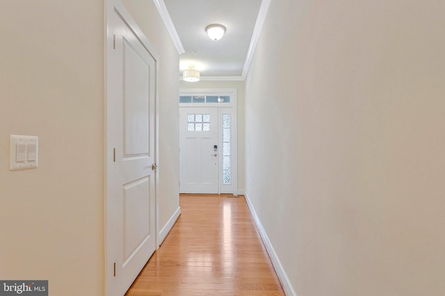 9726 Knowledge Dr, Laurel, MD 20723 - doorway to outside with ornamental molding, light wood-style floors, and baseboards