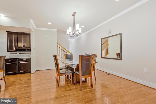 9726 Knowledge Dr, Laurel, MD 20723 - dining area featuring stairs, a chandelier, ornamental molding, light wood-style flooring, and baseboards