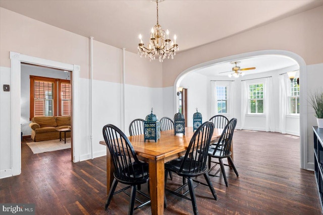 413 E A St, Brunswick, MD 21716 - dining room featuring arched walkways, dark wood-style flooring, a chandelier, and ceiling fan