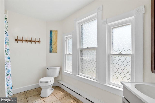 413 E A St, Brunswick, MD 21716 - full bath with tile patterned flooring, vanity, and baseboard heating