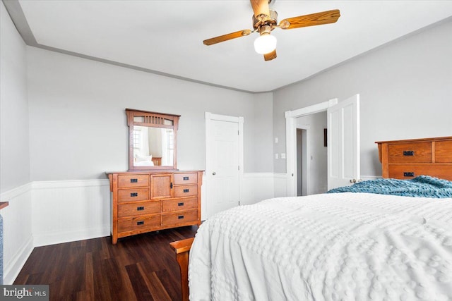 413 E A St, Brunswick, MD 21716 - bedroom with dark wood-style flooring, a wainscoted wall, and ceiling fan