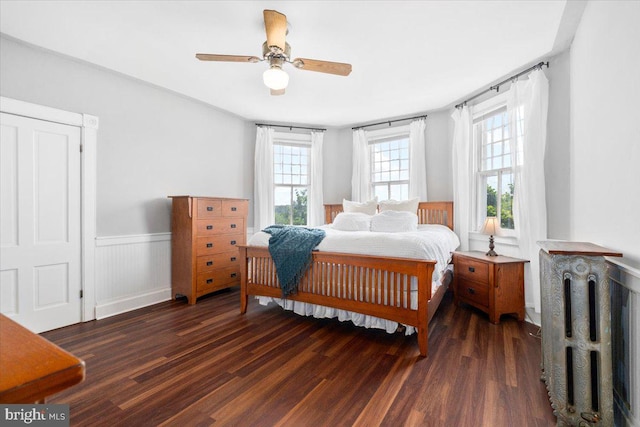 413 E A St, Brunswick, MD 21716 - bedroom featuring radiator heating unit, wood finished floors, a wainscoted wall, and a ceiling fan