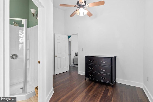 413 E A St, Brunswick, MD 21716 - bathroom featuring ceiling fan, a stall shower, wood finished floors, and a towering ceiling