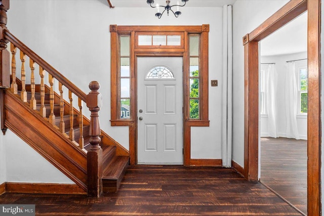 413 E A St, Brunswick, MD 21716 - foyer entrance featuring dark wood-type flooring, stairway, and a chandelier
