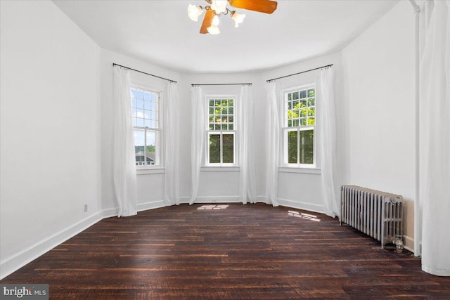 413 E A St, Brunswick, MD 21716 - spare room with radiator heating unit, plenty of natural light, and wood finished floors