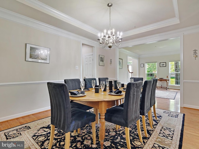 15446 Symondsbury Way, Upper Marlboro, MD 20774 - dining room featuring a chandelier, light wood finished floors, ornamental molding, baseboards, and a raised ceiling