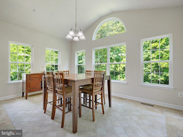 15446 Symondsbury Way, Upper Marlboro, MD 20774 - dining area featuring vaulted ceiling, a chandelier, light tile patterned floors, and baseboards