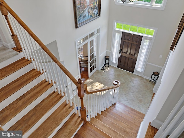 15446 Symondsbury Way, Upper Marlboro, MD 20774 - foyer with a high ceiling, healthy amount of natural light, stairway, and french doors
