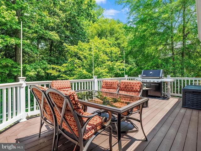 15446 Symondsbury Way, Upper Marlboro, MD 20774 - wooden terrace with area for grilling, outdoor dining space, and a wooded view
