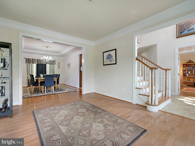 15446 Symondsbury Way, Upper Marlboro, MD 20774 - foyer entrance with stairway, wood finished floors, a chandelier, crown molding, and baseboards
