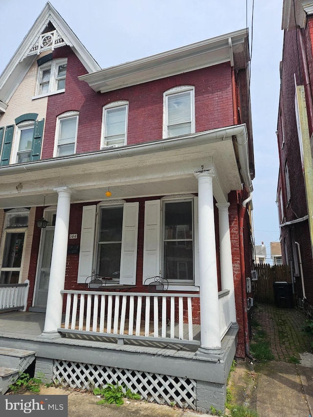 144 S Mulberry St S, Hagerstown, MD 21740 - view of property featuring a porch and brick siding