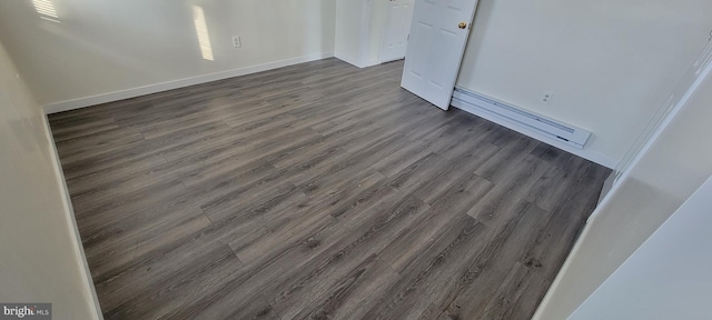 3063 Joyce St, Philadelphia, PA 19134 - unfurnished bedroom featuring a baseboard radiator, dark wood-style floors, and baseboards