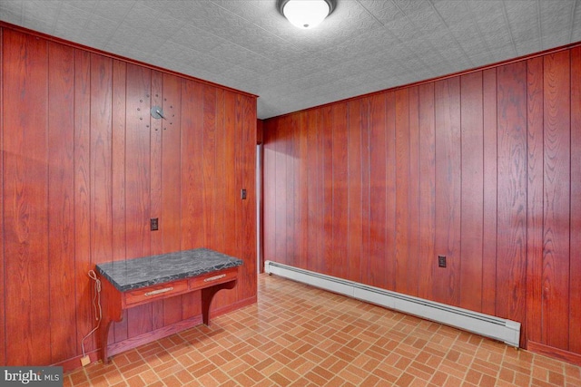 2500 Penn Ave, West Lawn, PA 19609 - mudroom with brick patterned floors, wood walls, a baseboard radiator, and an ornate ceiling