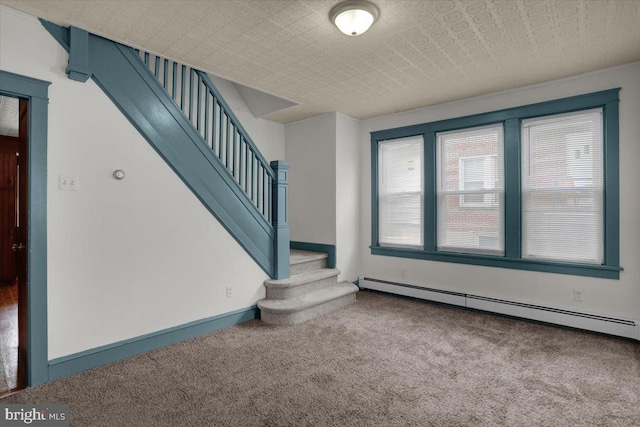 2500 Penn Ave, West Lawn, PA 19609 - carpeted foyer featuring baseboard heating, stairway, and baseboards