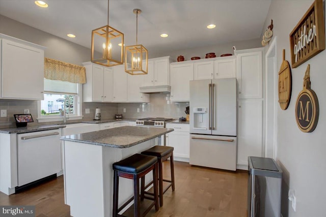 21 Bayberry Rd, Carlisle, PA 17013 - kitchen featuring white appliances, white cabinetry, backsplash, a kitchen island, and recessed lighting