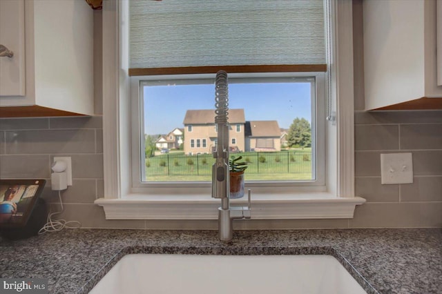 21 Bayberry Rd, Carlisle, PA 17013 - kitchen view of backsplash, white cabinets, and dark stone counters