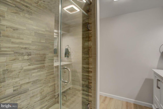 21 Bayberry Rd, Carlisle, PA 17013 - bathroom with vanity, a shower stall, and wood finished floors