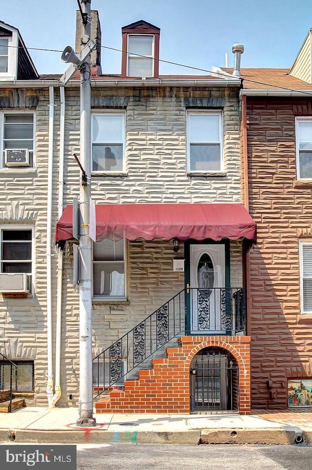 1008 Stiles St, Baltimore, MD 21202 - view of front of house with cooling unit and stone siding