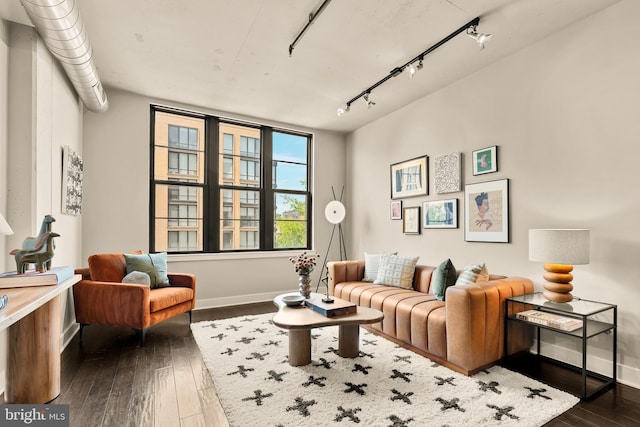 2125 14th St NW Unit 427, Washington, DC 20009 - living area featuring dark wood-type flooring, baseboards, and rail lighting