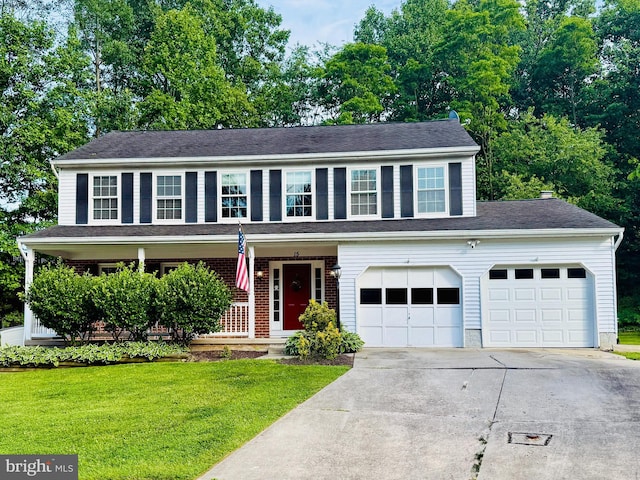 15 Topwood Ct, Parkville, MD 21234 - view of front of home featuring driveway, a front yard, covered porch, and a garage