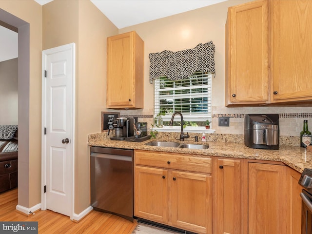 6529 Carston Ct, Frederick, MD 21703 - kitchen featuring dishwasher, a sink, light wood-style floors, decorative backsplash, and light stone countertops