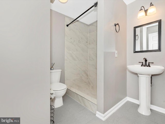 6529 Carston Ct, Frederick, MD 21703 - bathroom featuring toilet, a tile shower, and baseboards