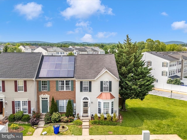 6529 Carston Ct, Frederick, MD 21703 - view of front of house with a residential view, a front lawn, solar panels, and a mountain view