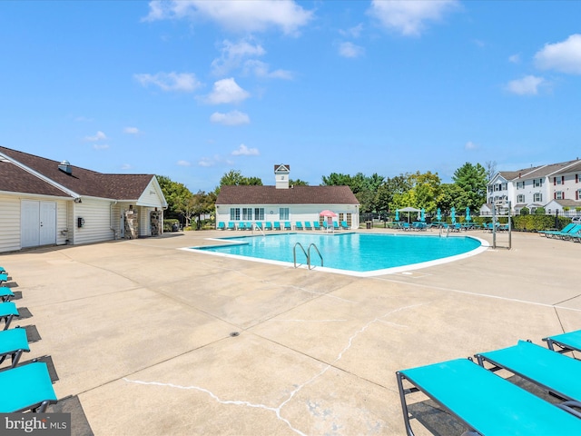 6529 Carston Ct, Frederick, MD 21703 - community pool with a patio and a residential view