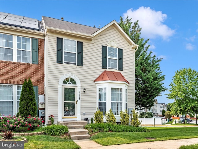 6529 Carston Ct, Frederick, MD 21703 - townhome / multi-family property featuring a front lawn and entry steps