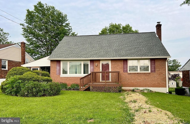 838 N Hanover St, Pottstown, PA 19464 - view of front facade with a front lawn, brick siding, and roof with shingles