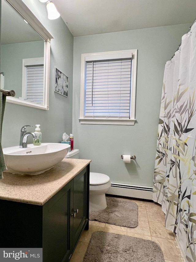 838 N Hanover St, Pottstown, PA 19464 - bathroom with baseboard heating, vanity, toilet, tile patterned flooring, and a shower with curtain