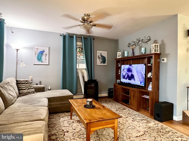 838 N Hanover St, Pottstown, PA 19464 - living room featuring a baseboard heating unit, ceiling fan, wood finished floors, and baseboards