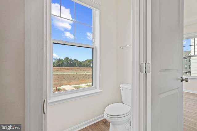 15006 General Lafayette Blvd, Brandywine, MD 20613 - bathroom featuring baseboards, wood finished floors, and toilet