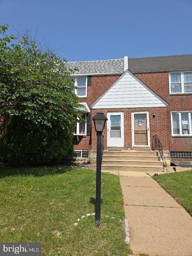 6340 Calvert St, Philadelphia, PA 19149 - multi unit property with brick siding, a front yard, and entry steps