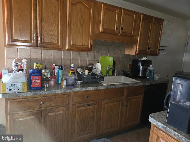 6340 Calvert St, Philadelphia, PA 19149 - kitchen featuring a sink, tasteful backsplash, brown cabinets, and light tile patterned flooring