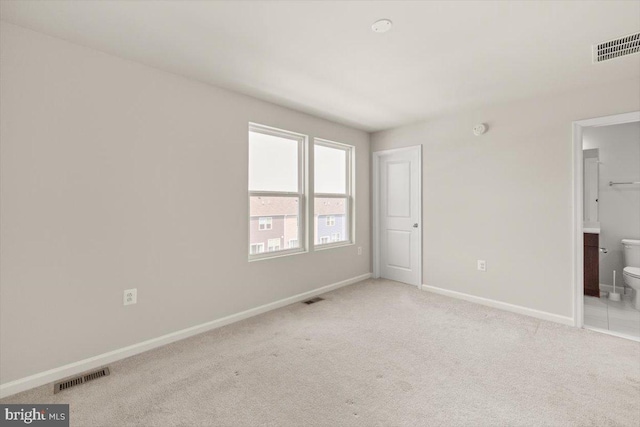 64 Anthem St, Ranson, WV 25438 - unfurnished bedroom featuring baseboards, light carpet, and ensuite bath