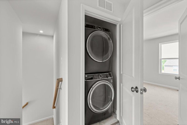 64 Anthem St, Ranson, WV 25438 - washroom featuring stacked washing machine and dryer, baseboards, carpet floors, and recessed lighting
