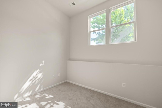 64 Anthem St, Ranson, WV 25438 - spare room featuring baseboards and light carpet