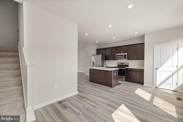 64 Anthem St, Ranson, WV 25438 - kitchen with appliances with stainless steel finishes, baseboards, light wood-type flooring, light countertops, and recessed lighting