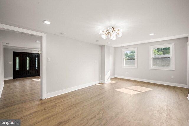 8255 Mertztown Rd, Alburtis, PA 18011 - spare room featuring a chandelier, wood finished floors, recessed lighting, and baseboards