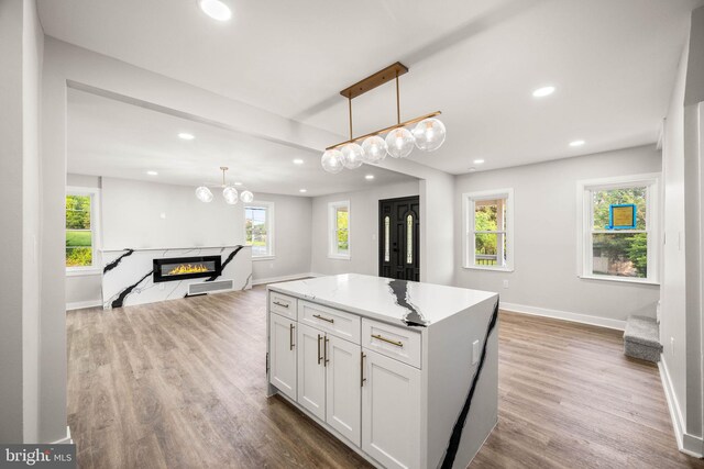 8255 Mertztown Rd, Alburtis, PA 18011 - kitchen featuring open floor plan, recessed lighting, baseboards, white cabinets, and wood finished floors