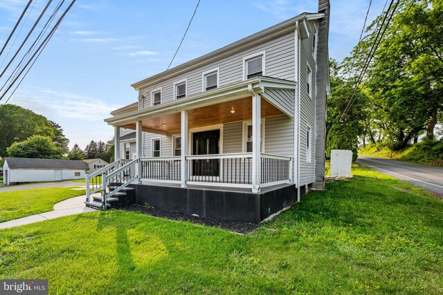 8255 Mertztown Rd, Alburtis, PA 18011 - view of front of house with covered porch and a front lawn