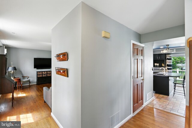 6082 Drum Point Rd, Deale, MD 20751 - hall featuring light wood-style flooring and baseboards